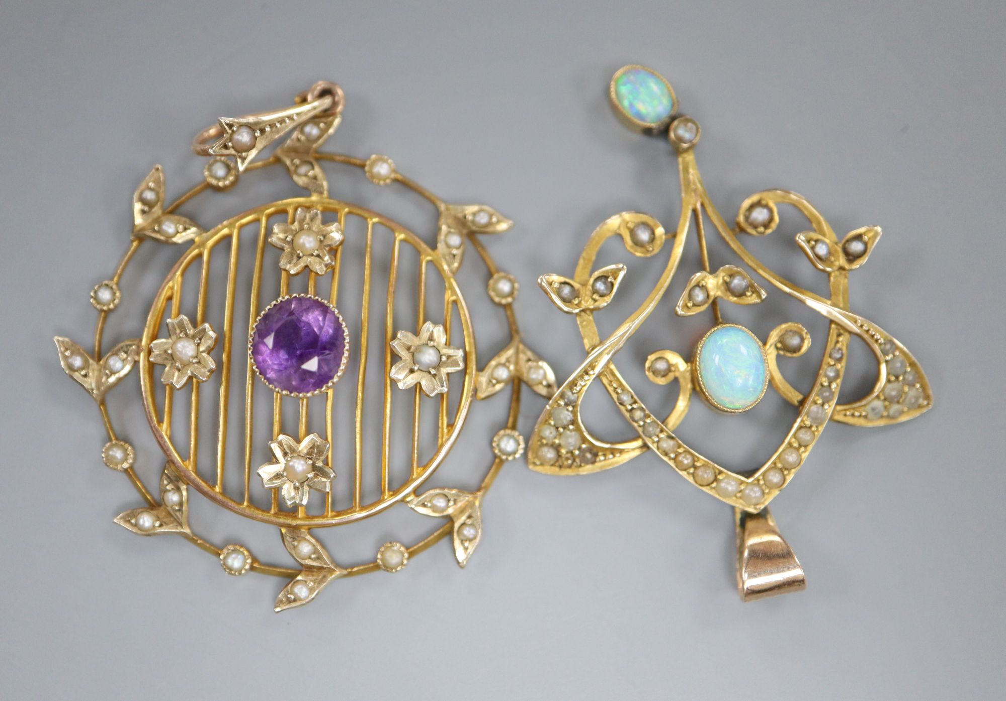 Two 9ct gem set pendants